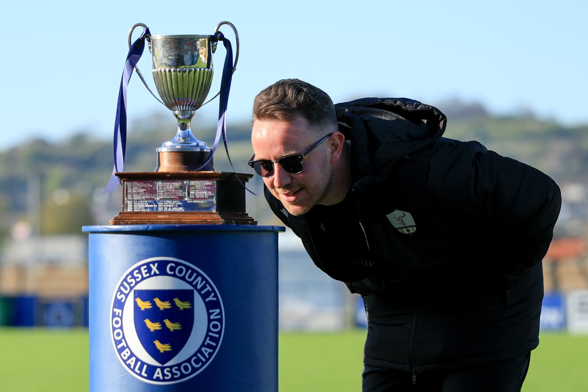Kissing the Sussex County FA Junior Cup trophy