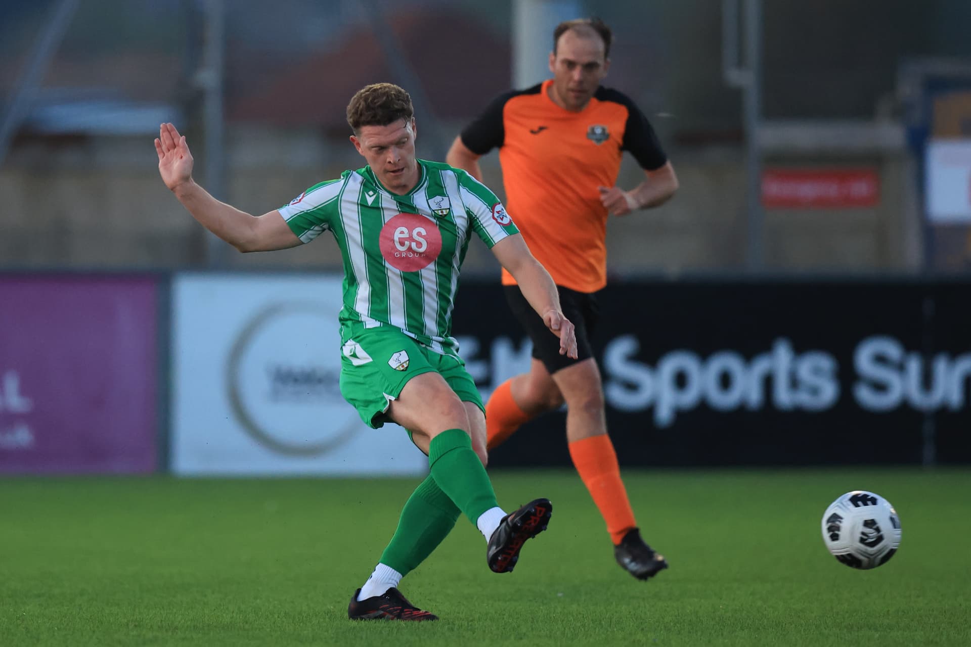 A Reserves player striking the ball towards goal