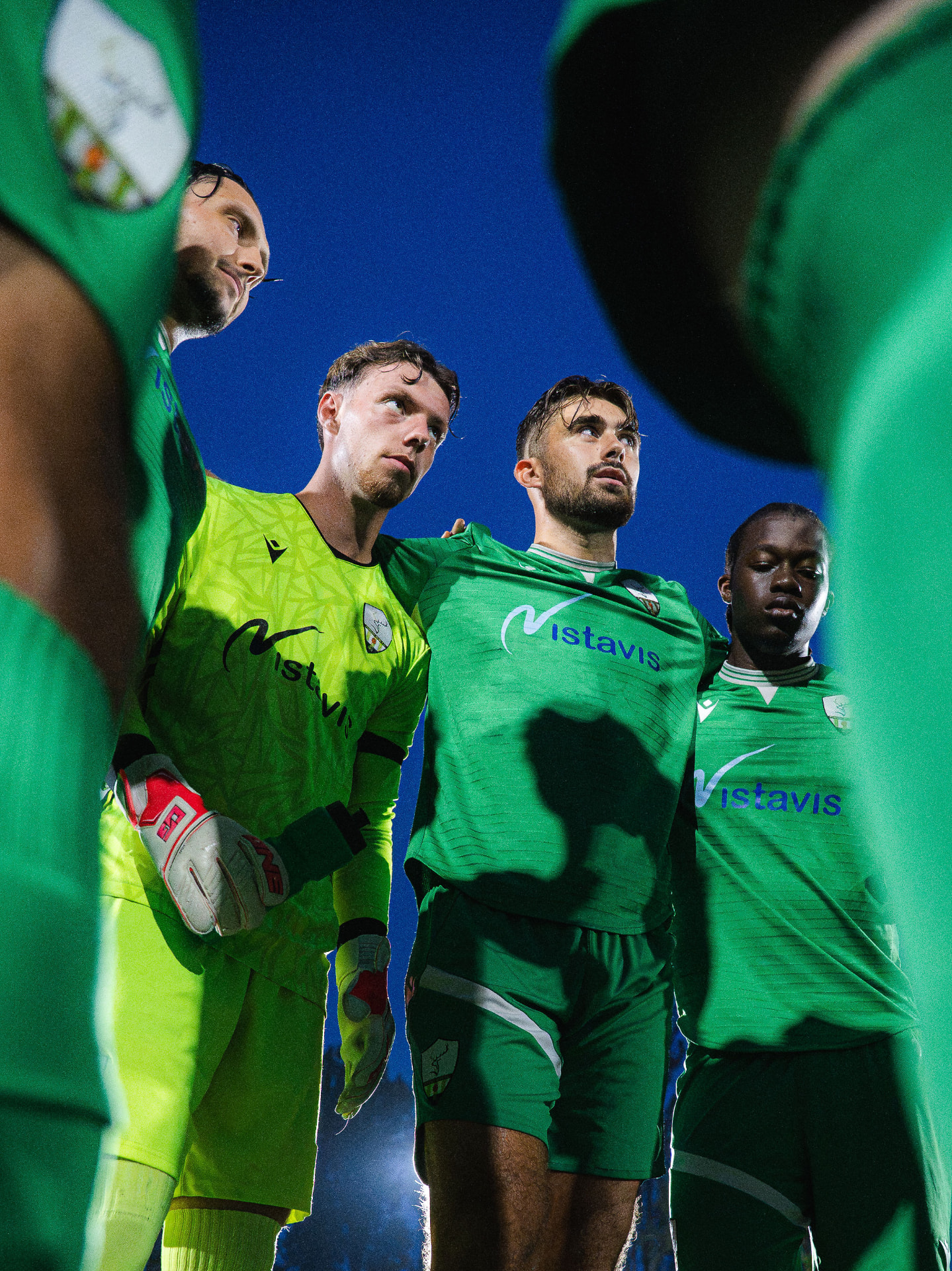 Forest Row players in a pre-match huddle under the floodlights