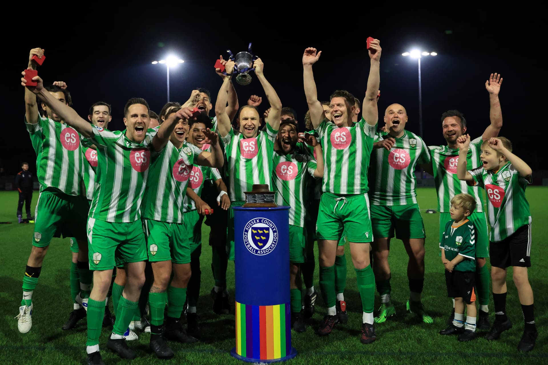 The Reserves lift the Sussex County FA Junior Cup under the floodlights